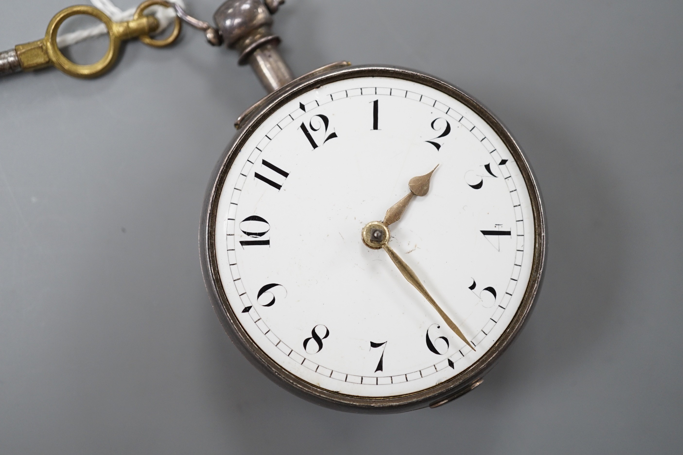 A George IV silver keywind verge pocket watch, by Tanner of Hailsham, with Arabic dial and engraved name verso, case diameter 51mm, with key, (missing outer case?).